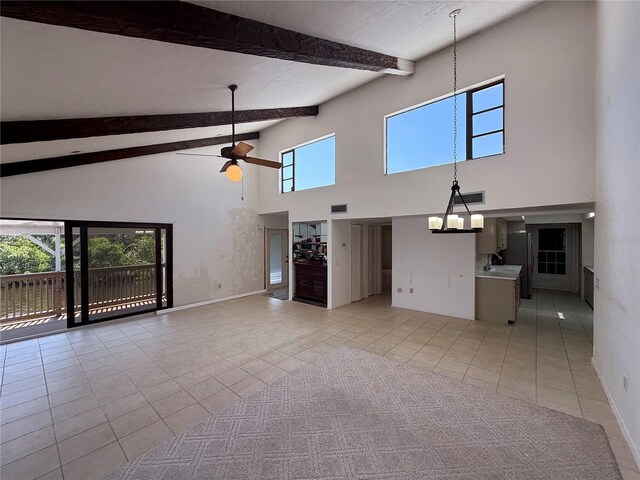 25188 Marion Ave Unit 1, Punta Gorda, FL 33950 - unfurnished living room featuring high vaulted ceiling, healthy amount of natural light, light tile patterned floors, beam ceiling, and ceiling fan