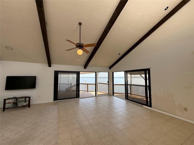 25188 Marion Ave Unit 1, Punta Gorda, FL 33950 - unfurnished living room featuring baseboards, a ceiling fan, beamed ceiling, high vaulted ceiling, and light tile patterned flooring