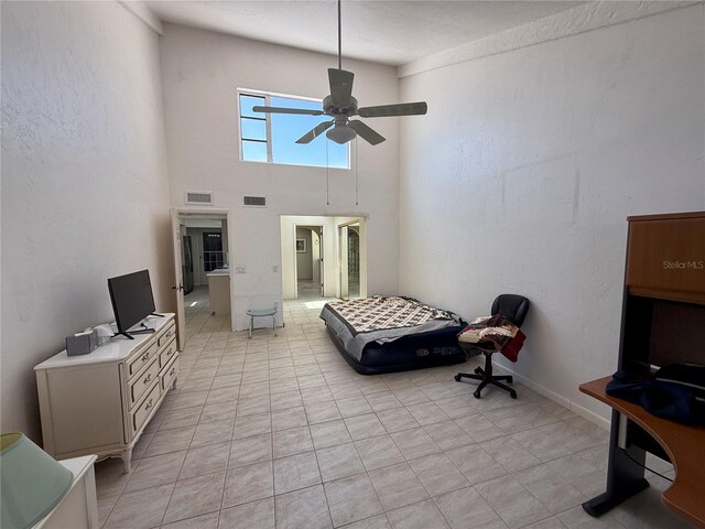 25188 Marion Ave Unit 1, Punta Gorda, FL 33950 - living area featuring a ceiling fan and a towering ceiling