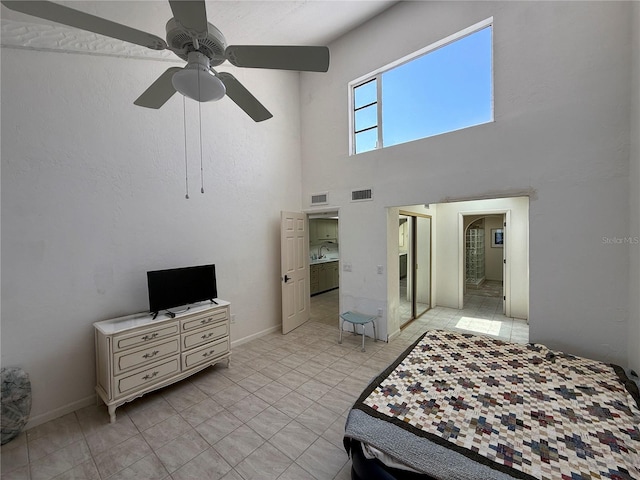 25188 Marion Ave Unit 1, Punta Gorda, FL 33950 - bedroom with a high ceiling, ceiling fan, and baseboards
