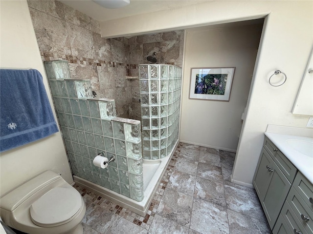 25188 Marion Ave Unit 1, Punta Gorda, FL 33950 - bathroom with toilet, vanity, walk in shower, stone finish floors, and baseboards