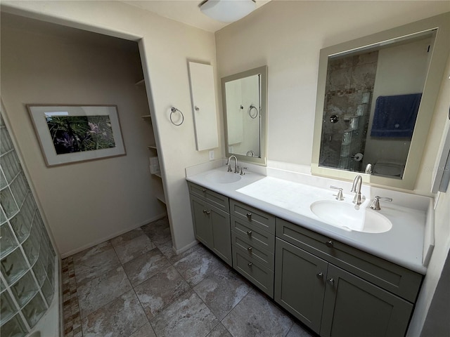 25188 Marion Ave Unit 1, Punta Gorda, FL 33950 - full bath featuring double vanity, a tile shower, and baseboards