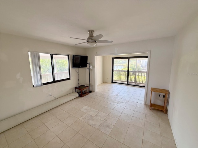 25188 Marion Ave Unit 1, Punta Gorda, FL 33950 - empty room featuring healthy amount of natural light, a ceiling fan, and light tile patterned floors