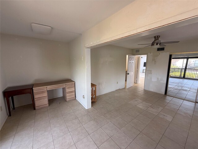 25188 Marion Ave Unit 1, Punta Gorda, FL 33950 - empty room with light tile patterned flooring and ceiling fan