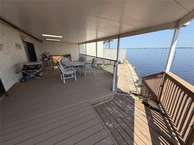 25188 Marion Ave Unit 1, Punta Gorda, FL 33950 - dock with a water view and outdoor dining space