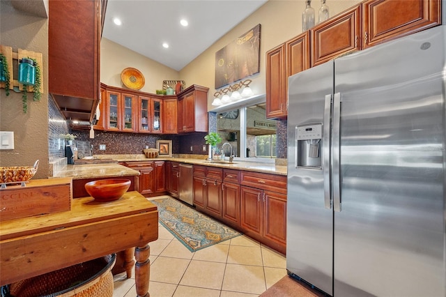 5600 Blackjack Ct S, Punta Gorda, FL 33982 - kitchen with appliances with stainless steel finishes, a sink, light tile patterned flooring, tasteful backsplash, and light stone countertops