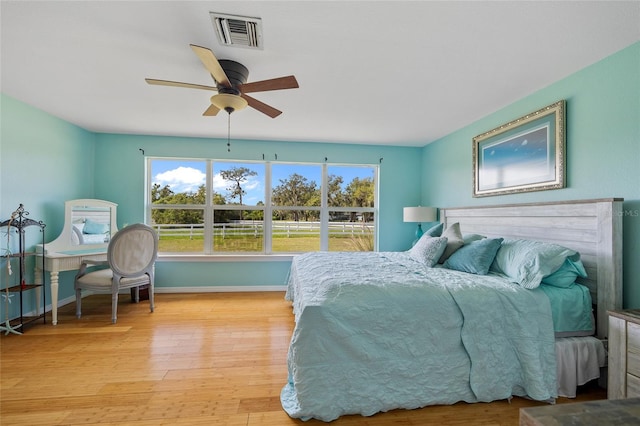 5600 Blackjack Ct S, Punta Gorda, FL 33982 - bedroom with multiple windows, light wood finished floors, and baseboards