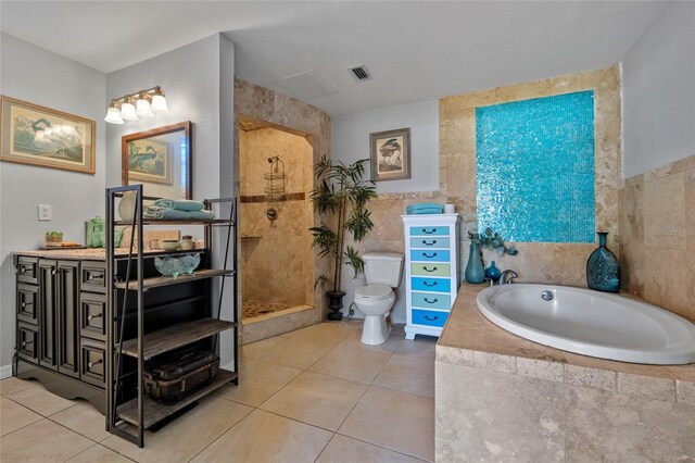 5600 Blackjack Ct S, Punta Gorda, FL 33982 - full bathroom featuring a garden tub, tile walls, vanity, tile patterned flooring, and toilet