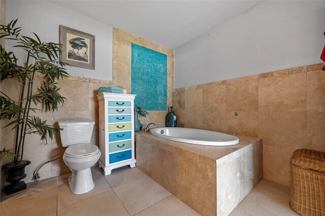 5600 Blackjack Ct S, Punta Gorda, FL 33982 - full bath featuring tile walls, toilet, a bath, and tile patterned flooring