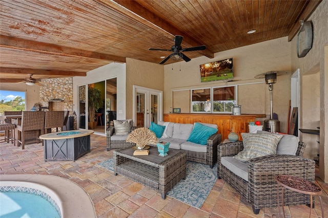 5600 Blackjack Ct S, Punta Gorda, FL 33982 - view of patio with an outdoor living space with a fire pit, ceiling fan, and french doors