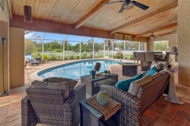 5600 Blackjack Ct S, Punta Gorda, FL 33982 - swimming pool featuring an outdoor hangout area, a ceiling fan, a patio, and glass enclosure