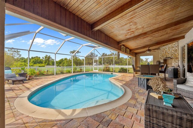 5600 Blackjack Ct S, Punta Gorda, FL 33982 - outdoor pool with a patio area, an outdoor fire pit, a ceiling fan, and a lanai