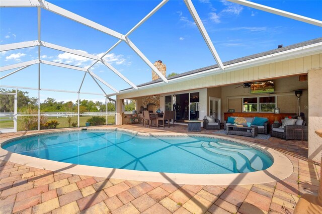 5600 Blackjack Ct S, Punta Gorda, FL 33982 - outdoor pool with an outdoor hangout area, a patio, a ceiling fan, and glass enclosure