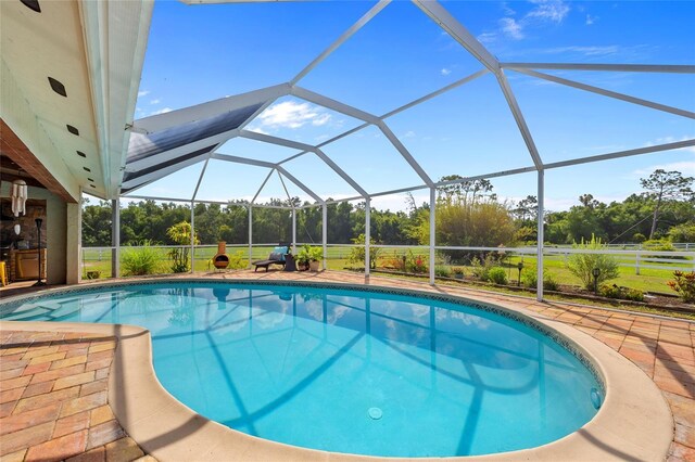 5600 Blackjack Ct S, Punta Gorda, FL 33982 - outdoor pool with a lanai, a patio area, and view of scattered trees
