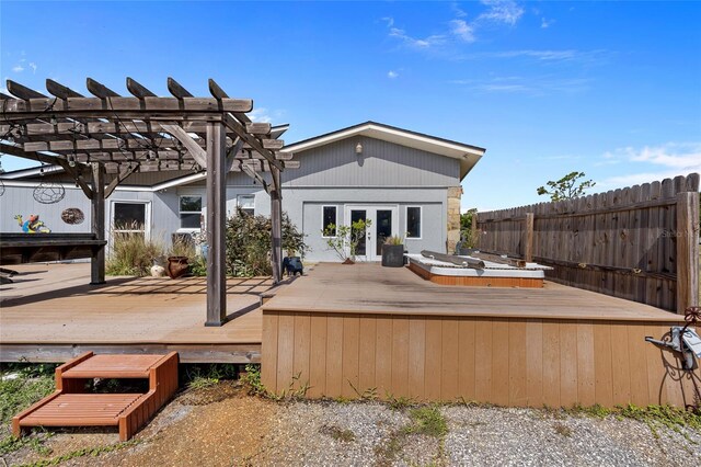 5600 Blackjack Ct S, Punta Gorda, FL 33982 - back of house featuring a wooden deck, french doors, and a pergola