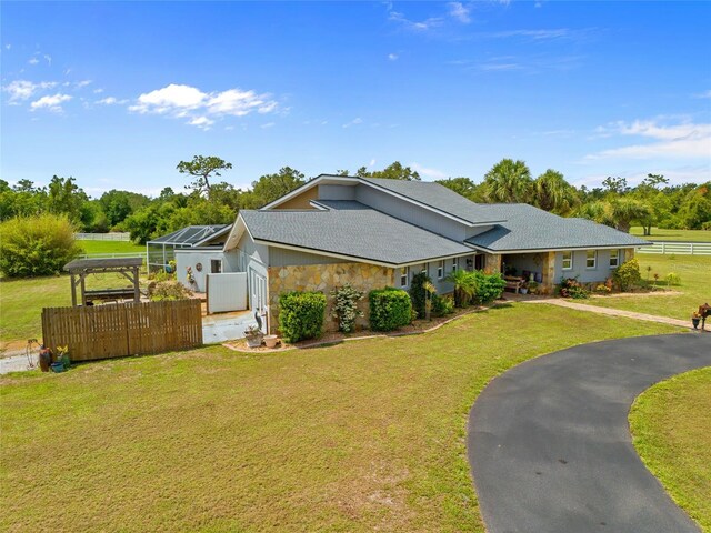 5600 Blackjack Ct S, Punta Gorda, FL 33982 - ranch-style home with stone siding and a lanai