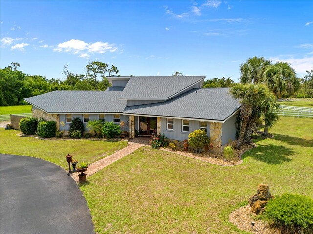 5600 Blackjack Ct S, Punta Gorda, FL 33982 - view of front of house with stone siding and a shingled roof
