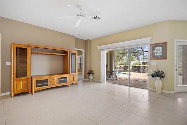 2747 Suncoast Lakes Blvd, Punta Gorda, FL 33980 - living area featuring baseboards, ceiling fan, and light tile patterned floors