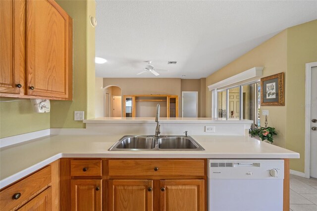 2747 Suncoast Lakes Blvd, Punta Gorda, FL 33980 - kitchen with dishwasher, a sink, light countertops, and a ceiling fan