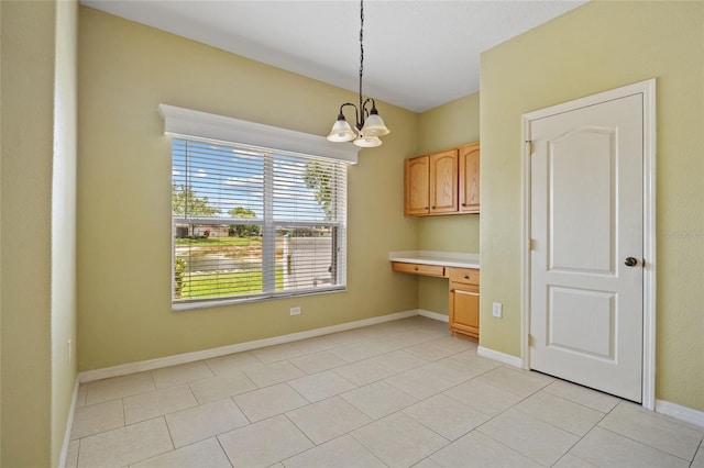 2747 Suncoast Lakes Blvd, Punta Gorda, FL 33980 - unfurnished dining area featuring a chandelier, baseboards, and light tile patterned flooring