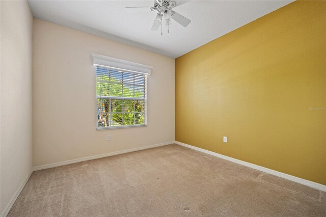 2747 Suncoast Lakes Blvd, Punta Gorda, FL 33980 - carpeted empty room featuring ceiling fan and baseboards