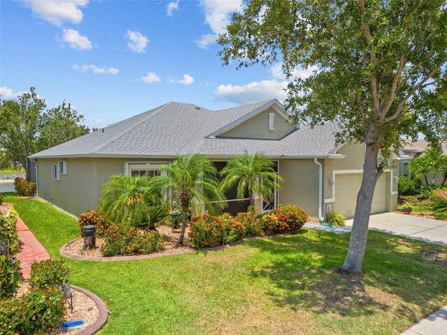 2747 Suncoast Lakes Blvd, Punta Gorda, FL 33980 - view of front of home with stucco siding, a front lawn, driveway, a garage, and roof with shingles