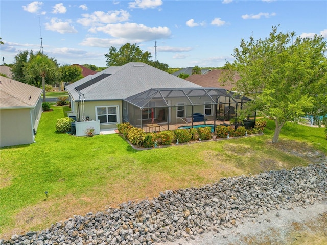 2747 Suncoast Lakes Blvd, Punta Gorda, FL 33980 - back of house with a yard, a patio area, an outdoor pool, and a lanai