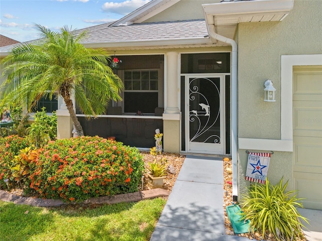 2747 Suncoast Lakes Blvd, Punta Gorda, FL 33980 - doorway to property featuring stucco siding and a shingled roof
