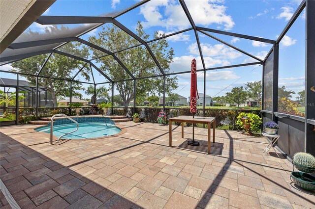 2747 Suncoast Lakes Blvd, Punta Gorda, FL 33980 - outdoor pool featuring a patio and glass enclosure
