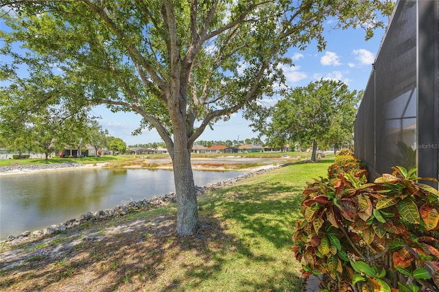 2747 Suncoast Lakes Blvd, Punta Gorda, FL 33980 - view of green lawn with a water view and a lanai