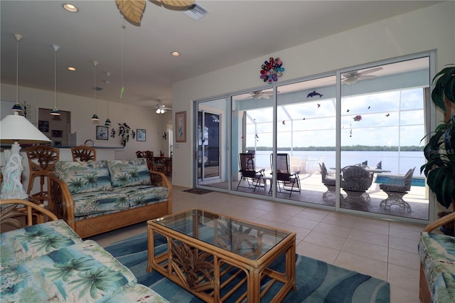 3772 Peace River Dr, Punta Gorda, FL 33983 - tiled living room with a ceiling fan, plenty of natural light, a water view, and recessed lighting