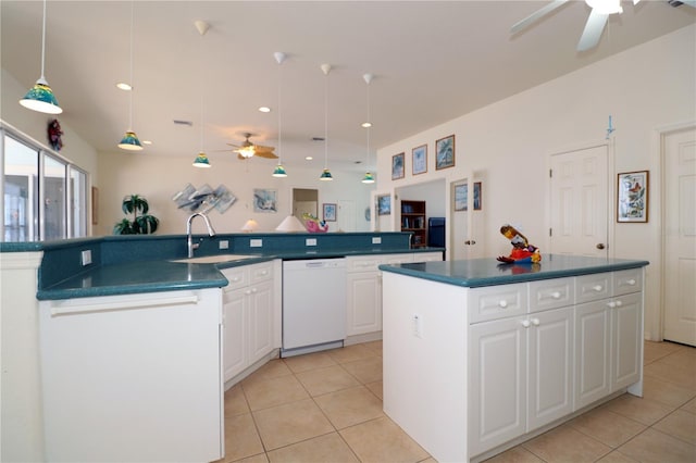 3772 Peace River Dr, Punta Gorda, FL 33983 - kitchen with white dishwasher, a kitchen island with sink, ceiling fan, a sink, and dark countertops