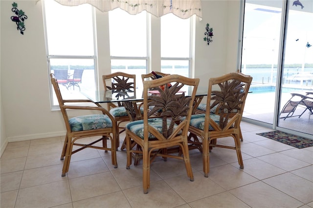 3772 Peace River Dr, Punta Gorda, FL 33983 - dining area with plenty of natural light, baseboards, and light tile patterned flooring