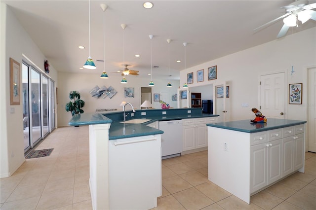 3772 Peace River Dr, Punta Gorda, FL 33983 - kitchen with white dishwasher, ceiling fan, a spacious island, a sink, and dark countertops