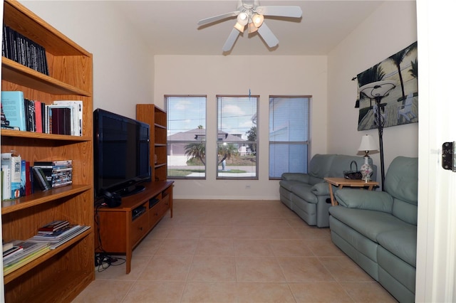 3772 Peace River Dr, Punta Gorda, FL 33983 - living area featuring a ceiling fan, light tile patterned flooring, and baseboards