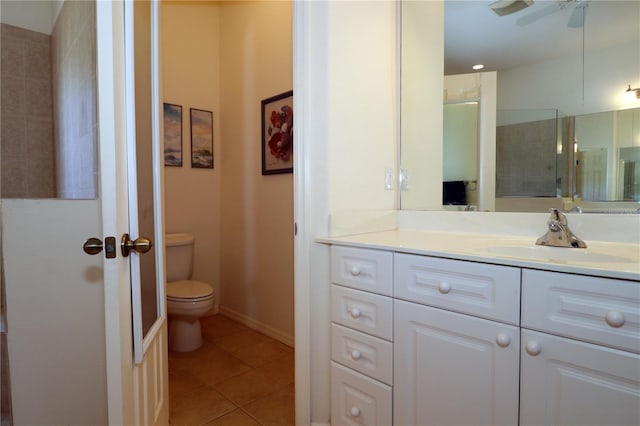 3772 Peace River Dr, Punta Gorda, FL 33983 - full bath featuring toilet, tile patterned floors, vanity, and a ceiling fan