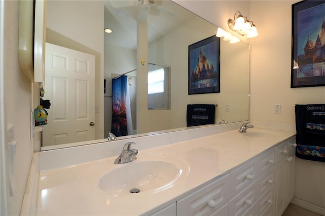 3772 Peace River Dr, Punta Gorda, FL 33983 - bathroom featuring double vanity and a ceiling fan