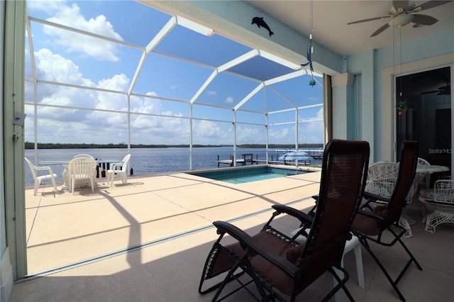 3772 Peace River Dr, Punta Gorda, FL 33983 - swimming pool with a patio area, a ceiling fan, glass enclosure, a water view, and a hot tub