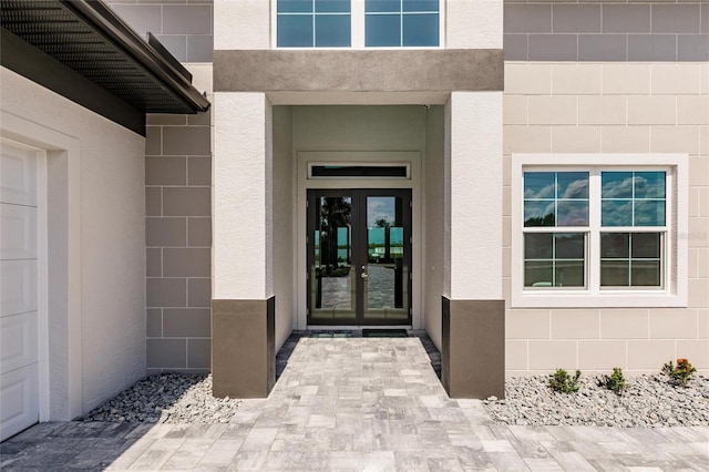 5061 Collingswood Blvd, Port Charlotte, FL 33948 - view of exterior entry featuring french doors and stucco siding