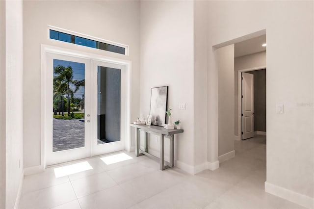 5061 Collingswood Blvd, Port Charlotte, FL 33948 - foyer with french doors, a high ceiling, and baseboards