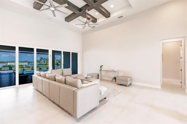 5061 Collingswood Blvd, Port Charlotte, FL 33948 - living room featuring a towering ceiling, coffered ceiling, a ceiling fan, beam ceiling, and baseboards
