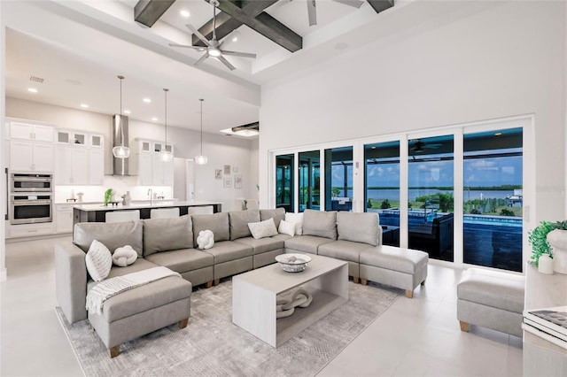5061 Collingswood Blvd, Port Charlotte, FL 33948 - living room featuring a ceiling fan, beamed ceiling, a towering ceiling, coffered ceiling, and recessed lighting