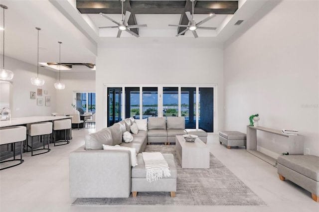 5061 Collingswood Blvd, Port Charlotte, FL 33948 - living room featuring a towering ceiling, coffered ceiling, ceiling fan, and beam ceiling