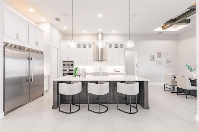 5061 Collingswood Blvd, Port Charlotte, FL 33948 - kitchen featuring appliances with stainless steel finishes, a breakfast bar, white cabinetry, and recessed lighting