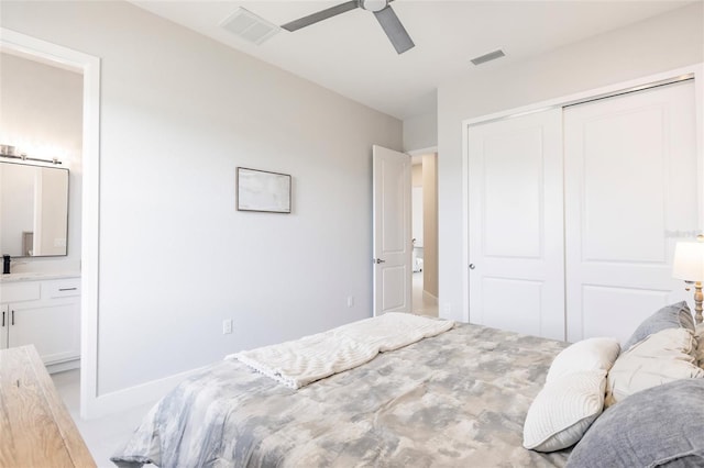 5061 Collingswood Blvd, Port Charlotte, FL 33948 - bedroom featuring a closet, ensuite bathroom, ceiling fan, and a sink