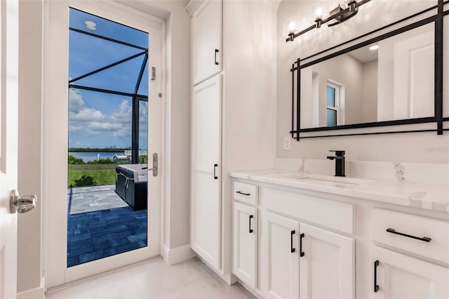 5061 Collingswood Blvd, Port Charlotte, FL 33948 - bathroom featuring vanity, a water view, and baseboards