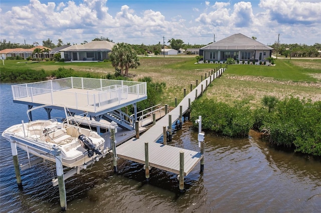 5061 Collingswood Blvd, Port Charlotte, FL 33948 - dock area with a water view, boat lift, and a yard