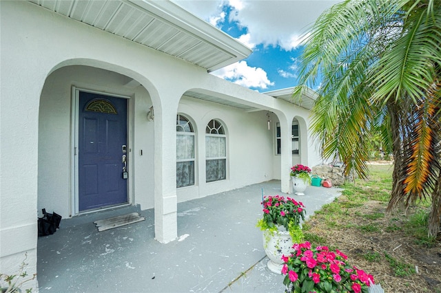 6103 Fabian Rd, North Port, FL 34287 - property entrance featuring stucco siding