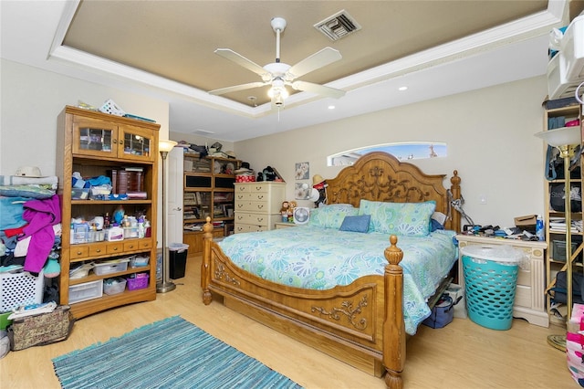 6103 Fabian Rd, North Port, FL 34287 - bedroom featuring a raised ceiling, wood finished floors, a ceiling fan, and recessed lighting