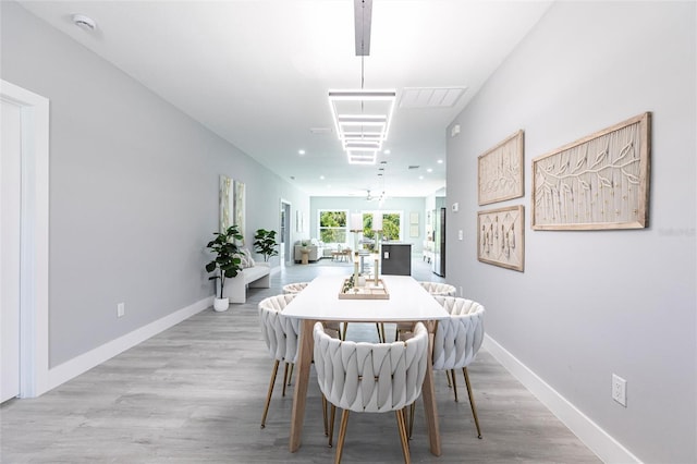 14350 Marlin Ave, Port Charlotte, FL 33953 - dining space featuring light wood-type flooring and baseboards